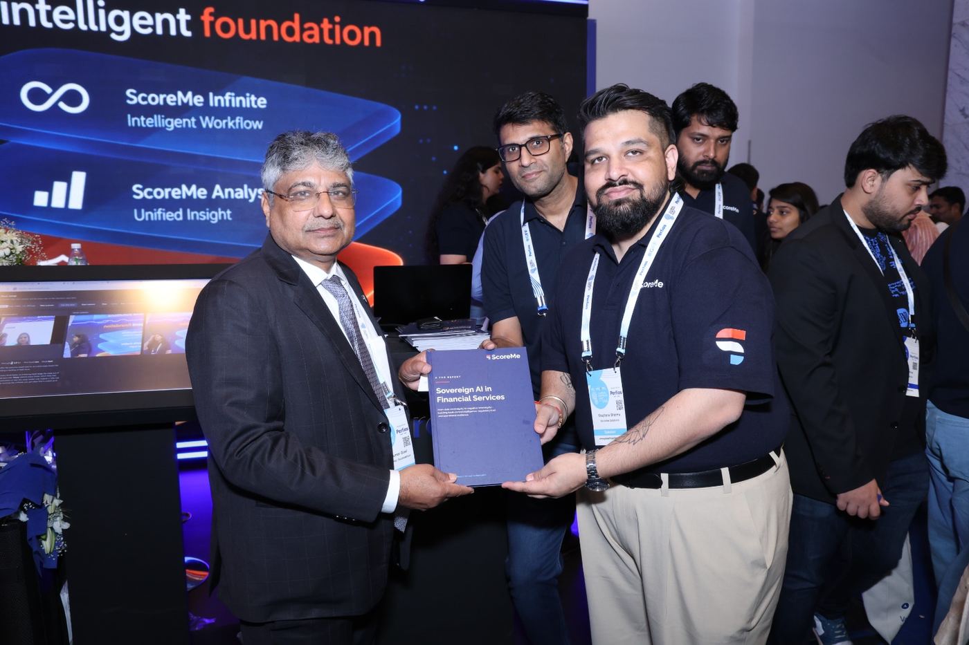 A delegate receiving a copy of the report at the ScoreMe stand.